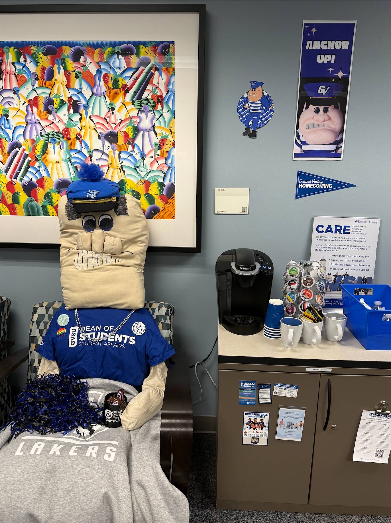 Dean of Students Office decor with stuffed Louie doll sitting in a chair